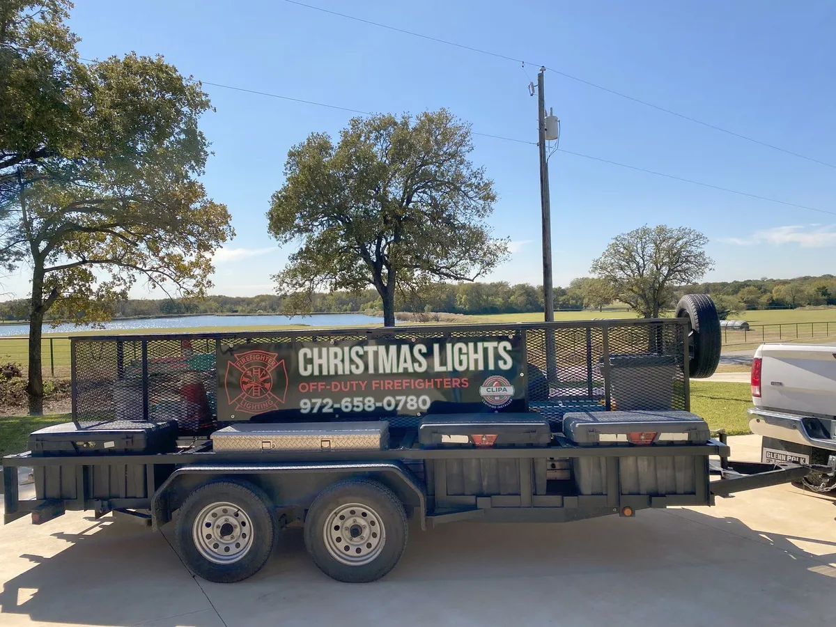 The equipment trailer loaded for the return to the storage building, installed by South Custom Lighting in North Texas