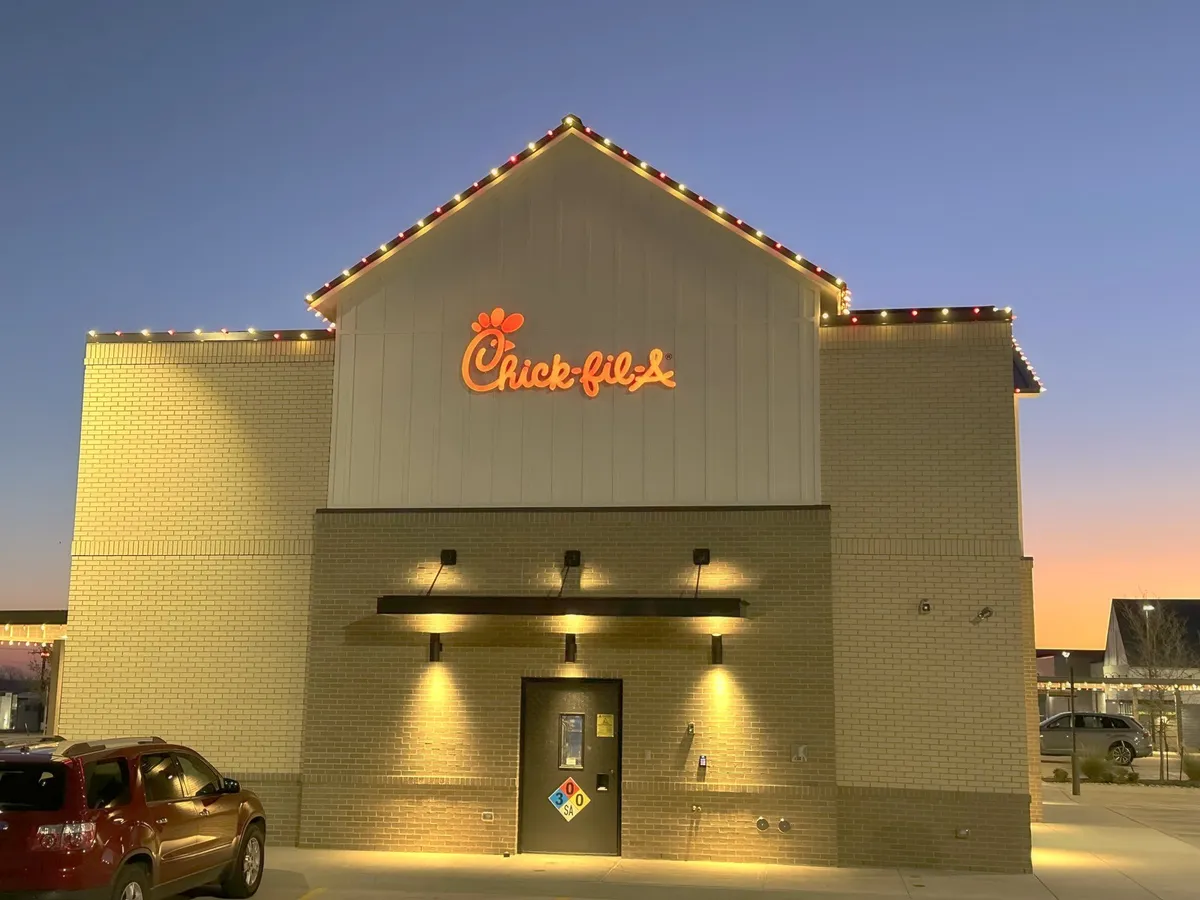 Restaurant gable lit against a winter sunset, installed by South Custom Lighting in North Texas