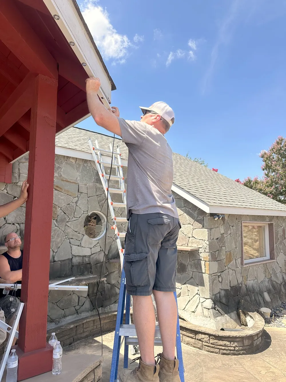 A South Custom Lighting crew installing lighting they will stand behind all season
